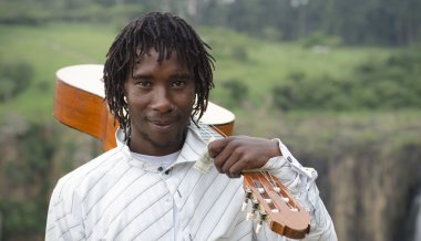 African busker with guitar on shoulder and ten rand note clipart