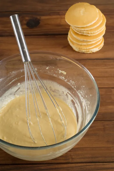 Pancake mixture and cakes — Stock Photo, Image
