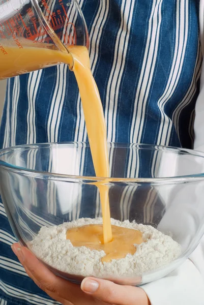 Cooking making pancake mixture — Stock Photo, Image