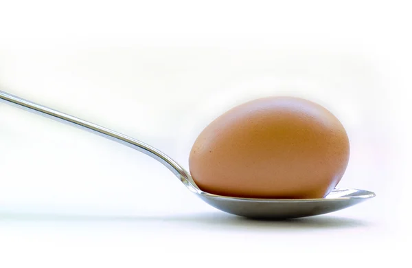 Egg on spoon — Stock Photo, Image