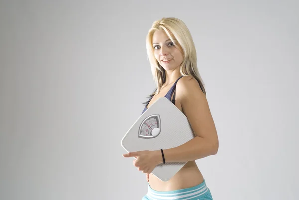 Slimming young woman happy with target diet weight — Stock Photo, Image