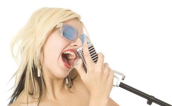 Pretty woman or girl music singer with microphone and sunglasses on white — Stock Photo, Image