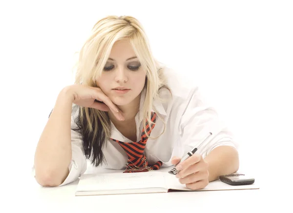Pretty teenage girl doing homework — Stock Photo, Image