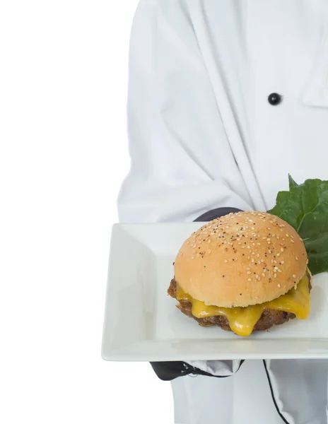 Chef or waiter serving cheesburger — Stock Photo, Image