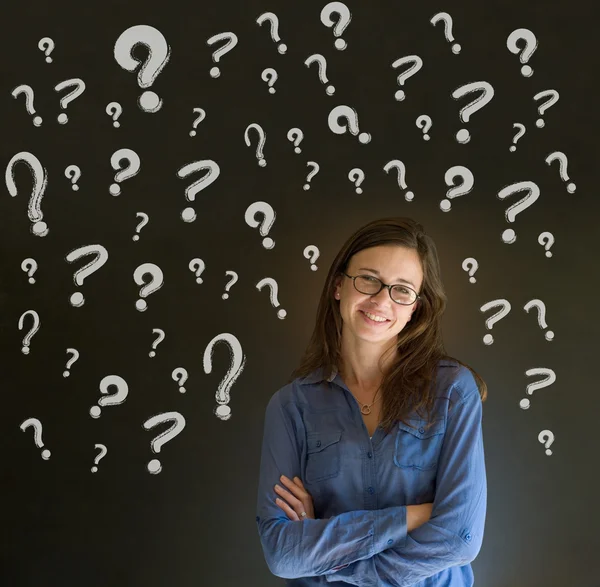 Thinking business woman with chalk question marks — Stock Photo, Image