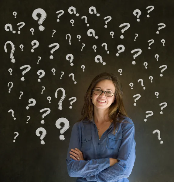 Thinking business woman with chalk question marks — Stock Photo, Image