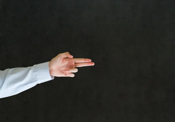 Man pointing fingers like a gun — Stock Photo, Image