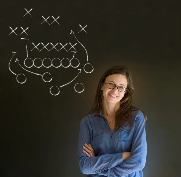 Woman with American football strategy on blackboard — Stock Photo, Image