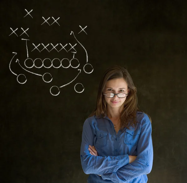 Woman with American football strategy on blackboard — Stock Photo, Image
