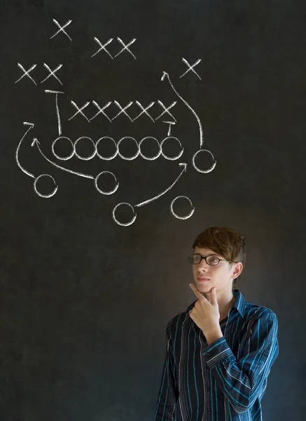 Man with American football strategy on blackboard — Stock Photo, Image