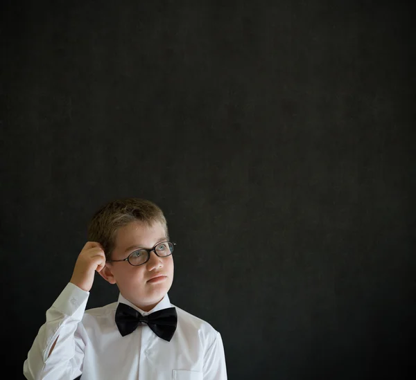 Scratching head thinking boy dressed up as business man — Stock Photo, Image