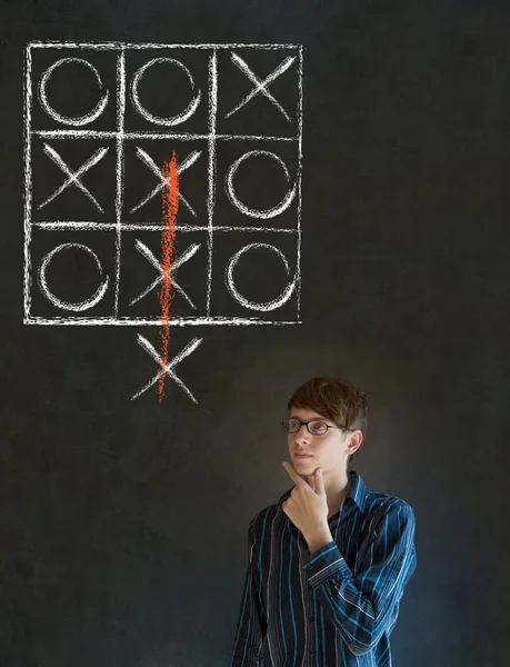 Thinking out of the box man on blackboard background — Stock Photo, Image