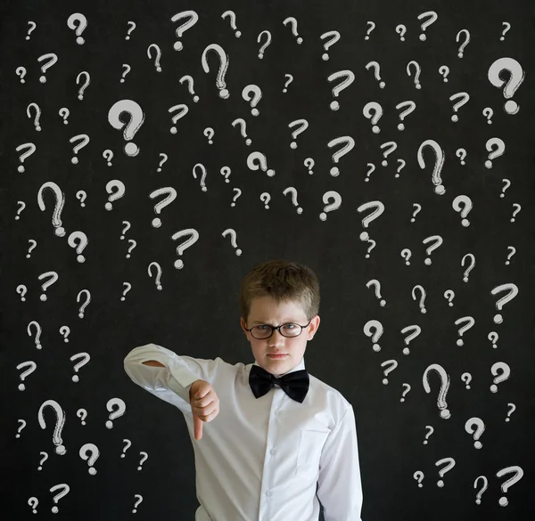 Thumbs down boy dressed as business man with chalk question marks — Stock Photo, Image