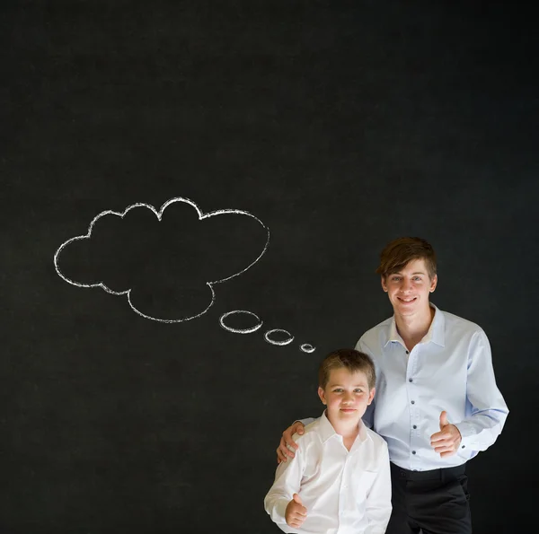 Tummen upp pojke klädd som affärsman och lärare med tanke tänkande krita moln — Stockfoto