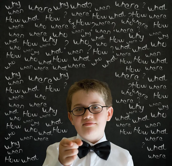 Education needs you thinking boy dressed up as business man with chalk questions — Stock Photo, Image