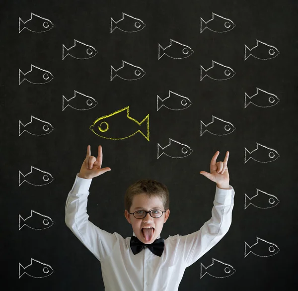 Knowledge rocks boy dressed as business man with independent thinking chalk fish — Stock Photo, Image