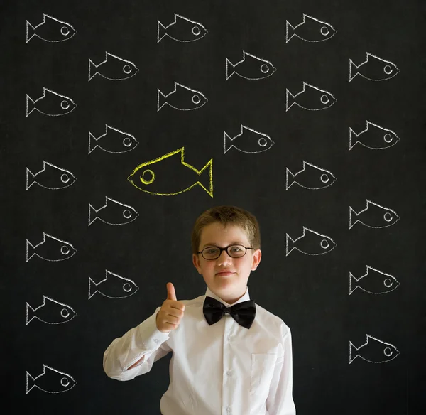 Thumbs up boy dressed as business man with independent thinking chalk fish — Stock Photo, Image