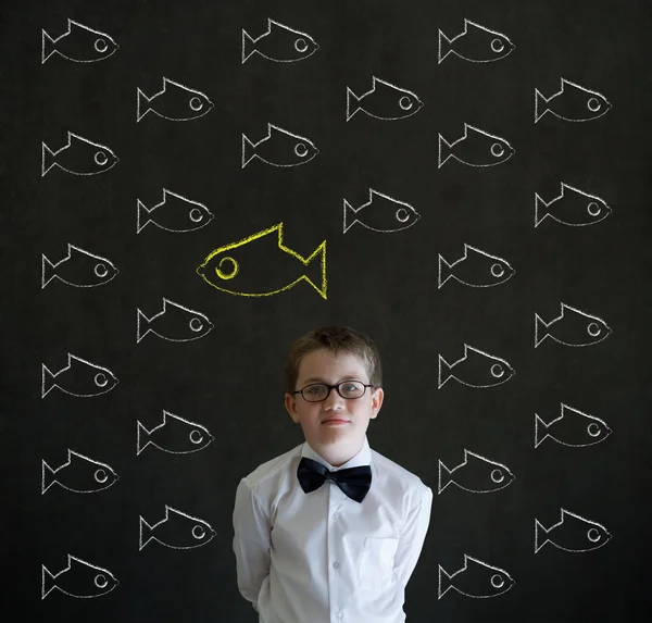 Thinking boy dressed as business man with independent thinking chalk fish — Stock Photo, Image