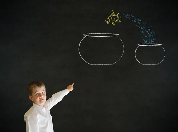 Pointing boy dressed as business man with chalk fish jump bowl — Stock Photo, Image