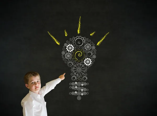 Pointing boy dressed as business man with bright idea gear cog lightbulb — Stock Photo, Image