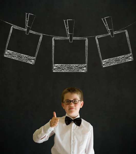 Thumbs up boy business man with hanging instant photo photograph on clothes line — Stock Photo, Image