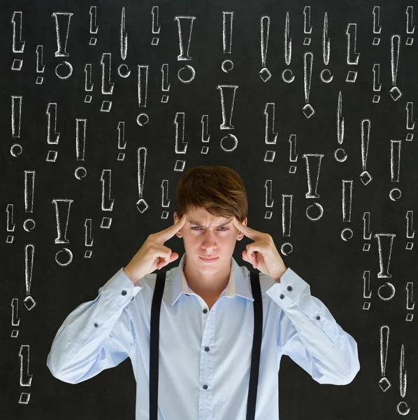 Thinking business man with chalk exclamation marks — Stock Photo, Image