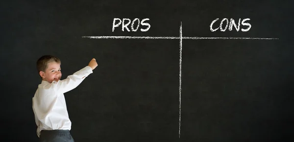 Writing boy business man with pros and cons list — Stock Image Writing boy business man with pros and cons list Royalty Free Stock Photos