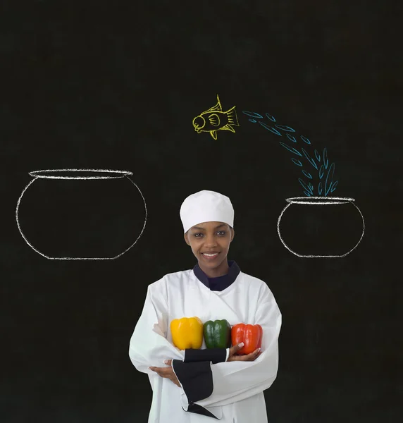 Woman chef jumping fish decision chalk blackboard background — Stock Photo, Image