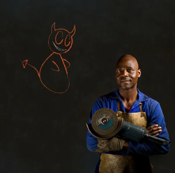 非洲黑人工业工人粉笔天使或魔鬼黑板上 — 图库照片