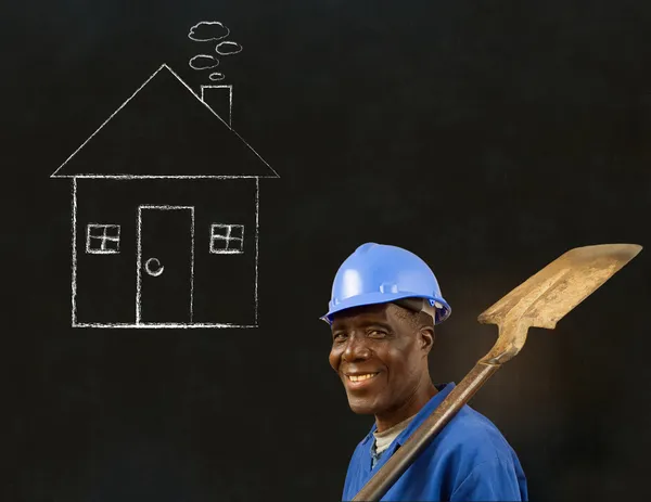 Africano nero uomo lavoratore con gesso casa su uno sfondo — Foto Stock