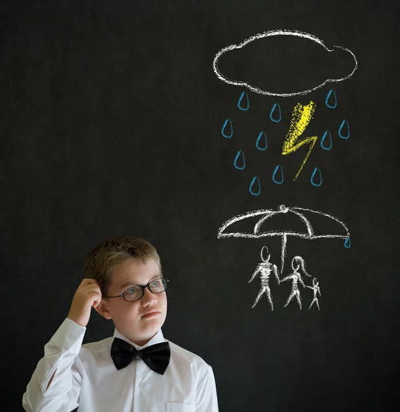 Thinking boy business man thinking about protecting family from natural disaster on blackboard background — Stock Photo, Image