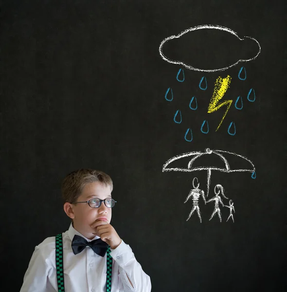 Thinking boy business man thinking about protecting family from natural disaster on blackboard background — Stock Photo, Image