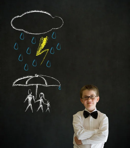 Thinking boy business man thinking about protecting family from natural disaster on blackboard background — Stock Photo, Image