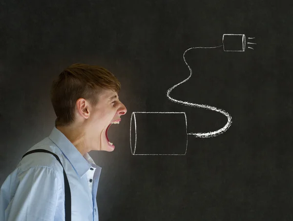 Media businessman shouting through chalk tin cup and string phone on blackboard background — Stock Photo, Image