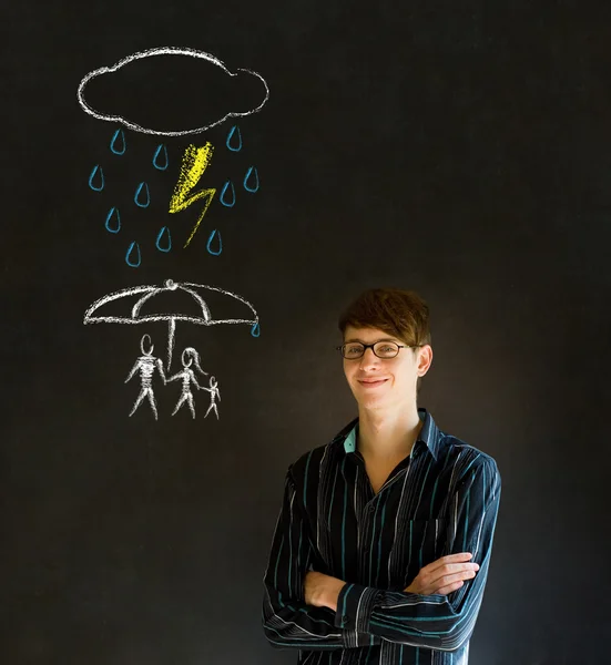 Man or Teacherthinking about protecting family from natural disaster on blackboard background — Stock Photo, Image