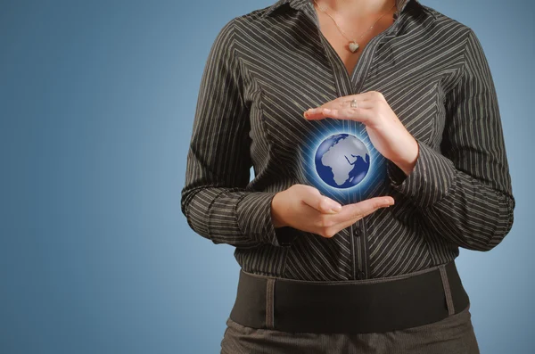 Businesswoman holds or holding world earth in hand — Stock Photo, Image