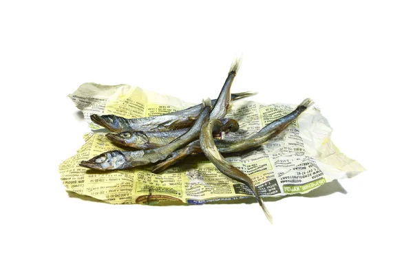 Peixe seco em um jornal antigo . — Fotografia de Stock