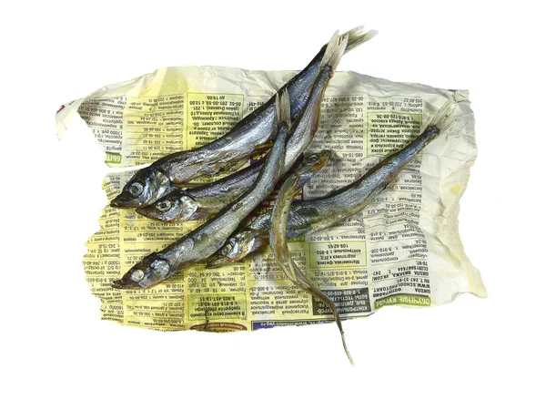 Szárított hal egy régi újság. — Stock Fotó