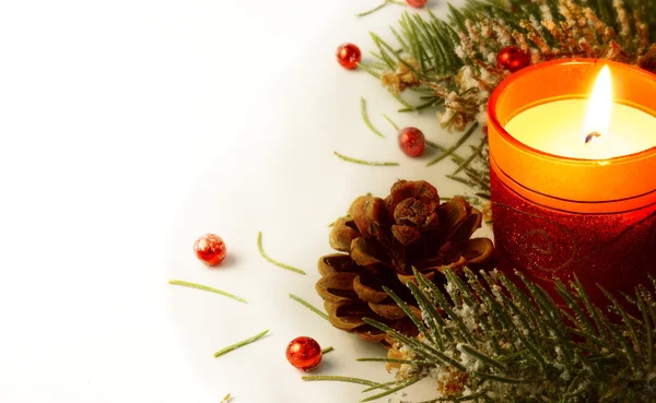 Christmas tree garland and candle — Stock Photo, Image