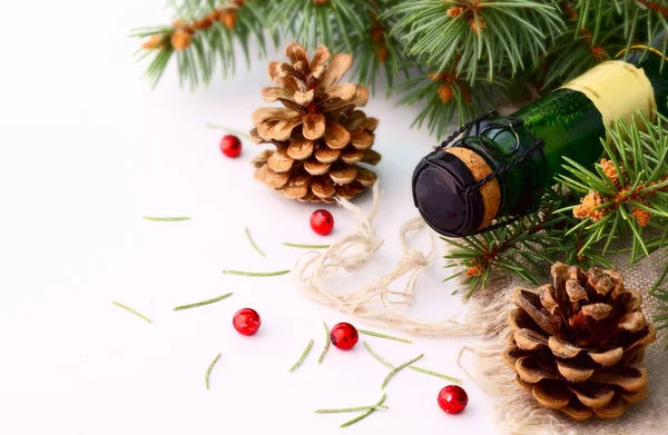 Christmas garland and a bottle of champagne — Stock Photo, Image