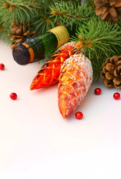 Christmas garland and a bottle of champagne — Stock Photo, Image