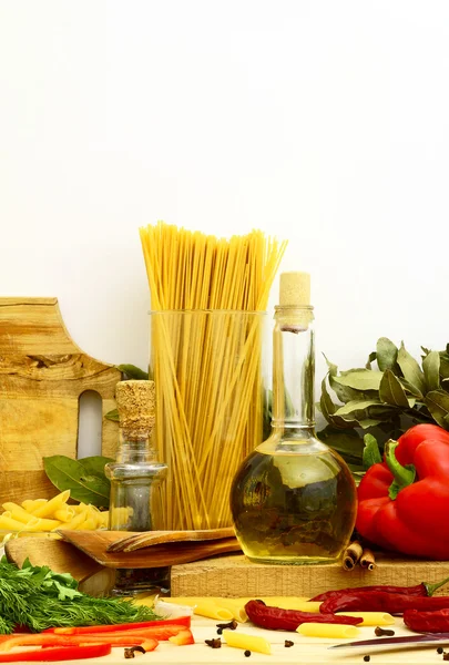 Uncooked pasta with vegetables and spices — Stock Photo, Image