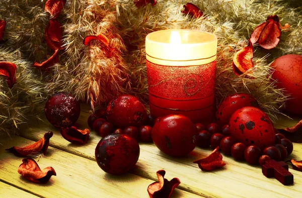 Easter eggs with candle and down — Stock Photo, Image