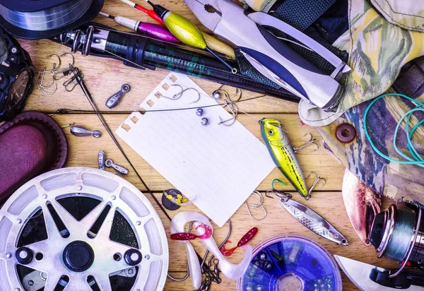 Fishing gear on the table as a frame — Stock Photo, Image