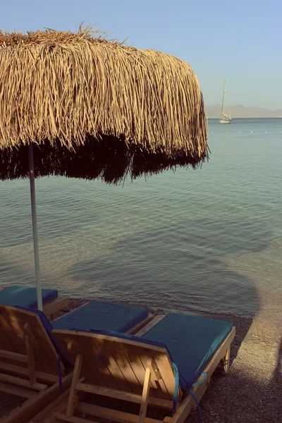 Sun bed with umbrella Royalty Free Stock Images