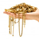 stock-photo-hand-holding-expensive-gold-jewelry