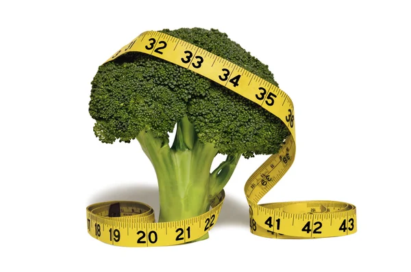 A Yellow Measuring Tape Draped Over a Stalk of Broccoli — Stock Photo, Image