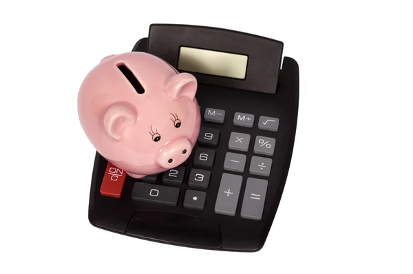 Piggy Bank sentado encima de la calculadora — Foto de Stock