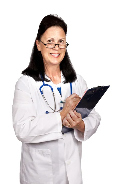 Female Mature Doctor Smiling and Holding a Clipboard — Stock Photo, Image