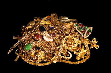 Pile Of Gold Jewelry On Black